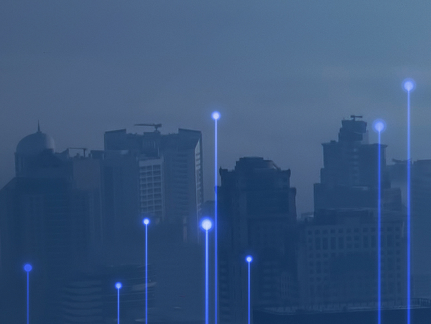 View of the city in the night overlaid with transmission nodes