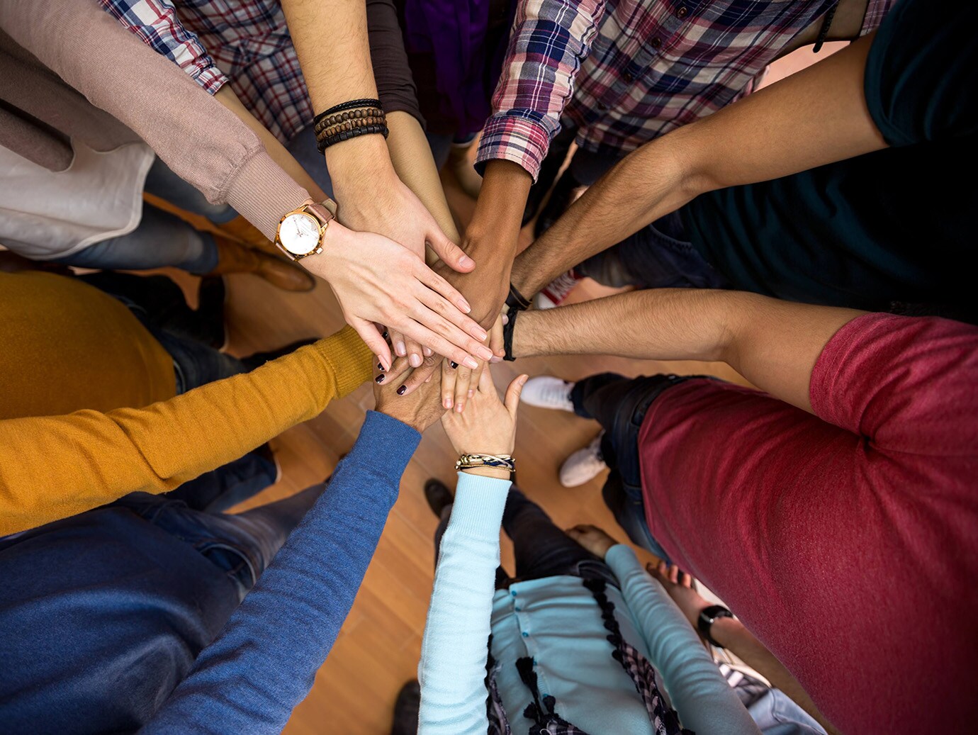 Close-up of all hands together